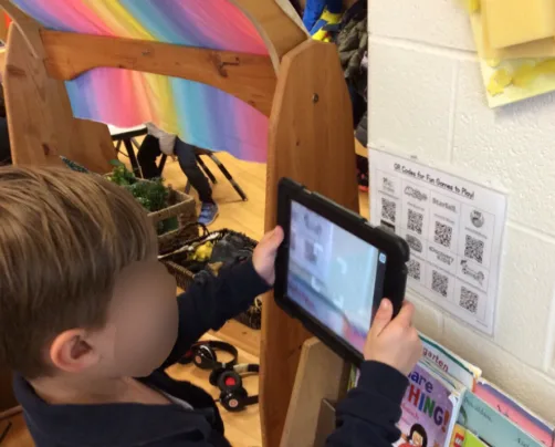 Child scanning QR at school canteen